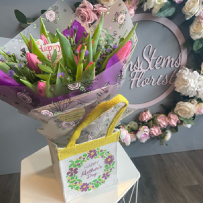 Mums Tulips - Hand tied bouquet of beautiful Pink Tulips in water and presented in a lovely Mum hessian bag.