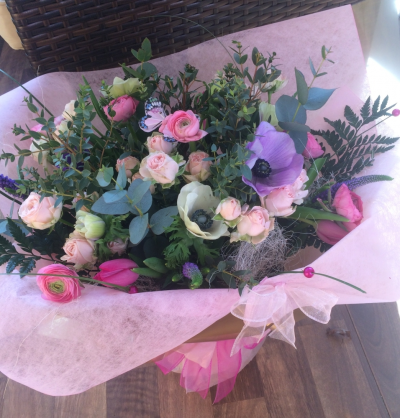Luxury Spring Bouquet - Beautifully arranged Bouquet presented in a luxury gift wrapped Aqua Pack. Includes Pastel Spring Flowers and beautiful Roses with a lovely selection of Foliage. Finished with a pretty Butterfly.Seasonal Bouquet - Flowers will vary past Spring!