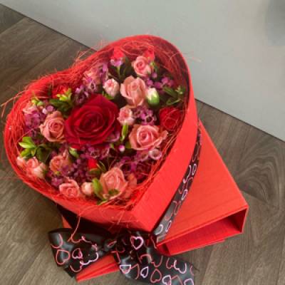 Box of love - This beautiful presented red heart box arrives closed and then opens up to reveal a lovely arrangement of fresh flowers. 
