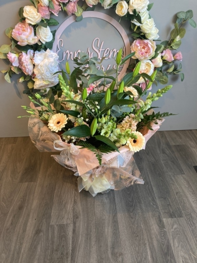 Peaches and Cream - Seasonal Flowers in shades of soft peach and cream arranged as a beautiful aqua packed bouquet.