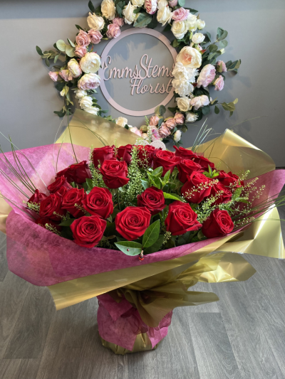 A Rose a day bouquet - A Red Rose a day, the ultimate I LOVE YOU Bouquet, specially hand tied and arranged into a stunning aqua packed bouquet.