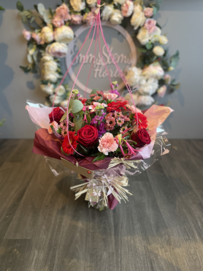 Ultimate Love - This Unique Stunning Bouquet is the ultimate show of love with the florists choice of stunning flowers including a mix of scented Roses.