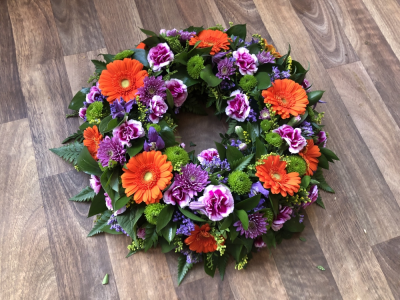 Wreath - Wreath - In Vibrant Colours, including Gerberas, Carnations, Roses and Chrysanthemums.Sizes from 12", 14" & 16"