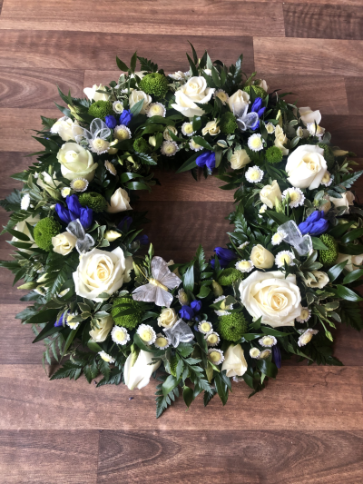 Blue and Cream Wreath - Wreath textured Tribute made in Blue and Cream Flowers. Sizes start from 12",14" & 16"