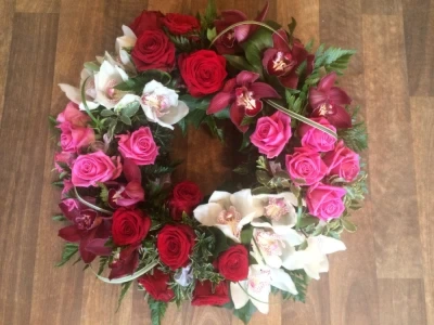 Luxury Wreath - This luxury Wreath has Orchids and Roses with some Beautiful Foliage.
