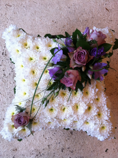 Cushion - Based in White with a Memory Lane Roses, Lilac Fressias Spray of Flowers