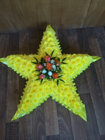 Star Tribute - Large Yellow Star Tribute with a lovely Spray Of Flowers in the centre.