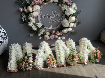 NANA - NANA Based Flowers with a ribbon edge with flower sprays. These can be made to your choice of colours. A minimum of 3 days is needed to order this tribute.