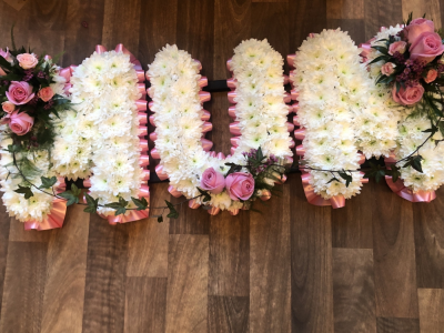 Mum Letters - MUM Letter Tribute with a Pale pink ribbon edge, White Base Flowers and beautiful Pink Rose Sprays