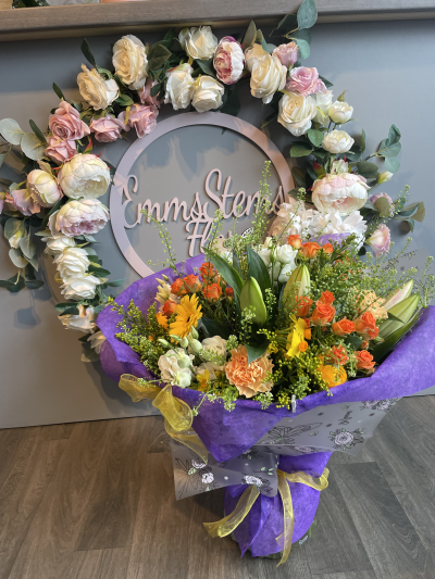 Full of fun Bouquet - Beautiful hand tied bouquet presented as an aqua packed bouquet in water. With seasonal fresh  flowers in yellow & orange shades.