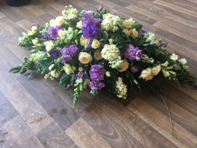 Lilac and Cream Coffin Spray - Beautiful soft Lilac and Cream seasonal flowers arranged with lovely soft following Foliage