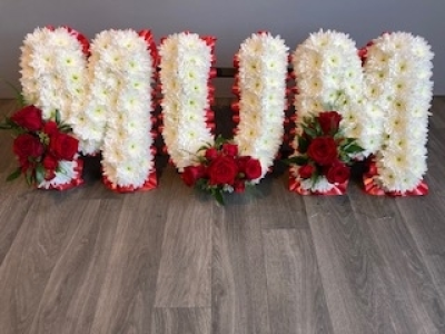 Red Mum - Mum - Arranged with a re ribbon edge, white base flowers and red rose letter sprays