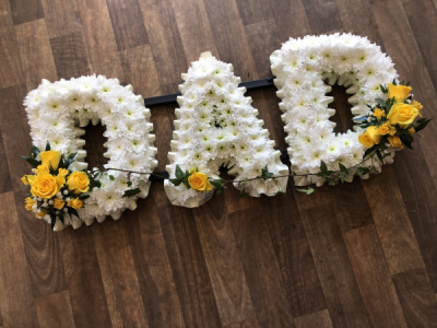Yellow Dad - DAD Letters with a soft Cream Ribbon Edge, White Base Flowers, finished with Yellow Roses Spray.