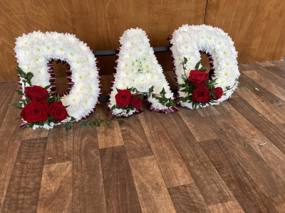 Red Dad Tribute - DAD- Red Ribbon edge, White based flowers, finished with Red Rose letter sprays