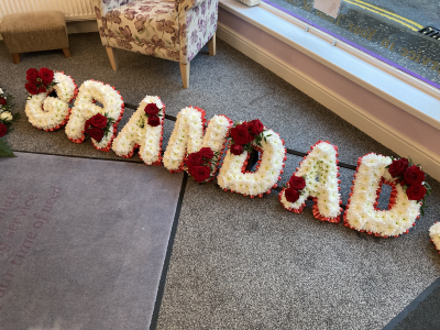 Red Grandad Tribute - Grandad Tribute. With Red Ribbon Edge, White Based Flowers and Red Rose letter sprays