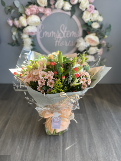 Peaches & Cream - Beautiful seasonal flowers in soft peach and cream colours, hand tied and finished in a luxury gift wrap presented in water.