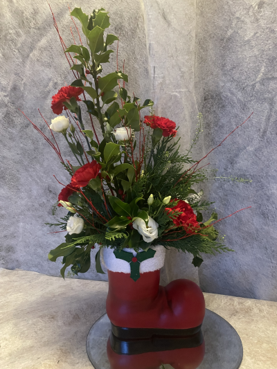 Santa's Boot - Beautiful long lasting flowers and foliage arranged in a lovely Ceramic Boot.