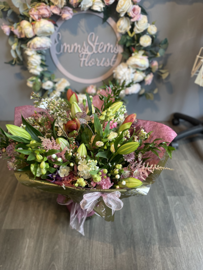 Celebration - Celebration Bouquet is full of beautiful seasonal flowers including Amaryllis. Certainly a show stopped of bouquets for that special someone.