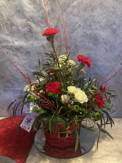 Santa's Basket - Stunning basket with Belt detail, filled with beautiful Red and white flowers and Christmas accessories.