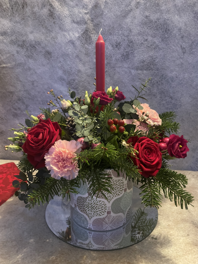 Baubles - This joyful arrangement is arranged in a stunning ceramic container with bauble printed detail. The flowers are in shades of red and pink. Beautiful all round display for any Christmas Table.