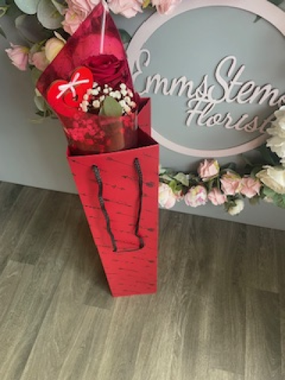 When one will do - Beautiful scented Rose with foliage and special Heart pick. Presented in a Glass vase inside a lovely tall deluxe bag.