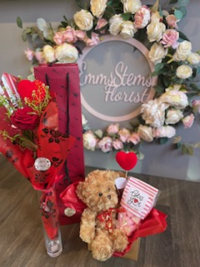 One in a Million Bundle of Love - Beautiful scented Rose with foliage and special Heart pick. Presented in a Glass vase inside a lovely tall deluxe bag & Lovely Teddy Bear and Mallow heart sweets gift.