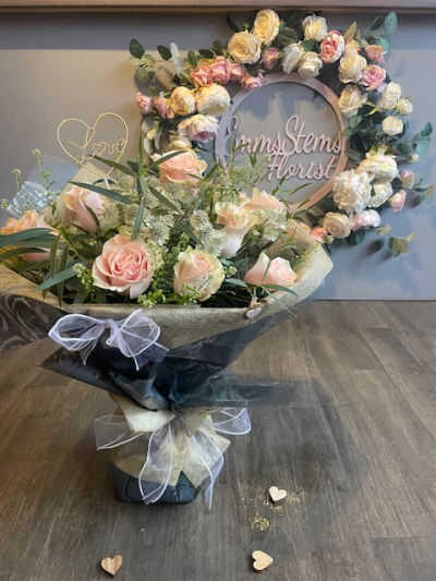 'Emms' Favourite Dozen Luxury Pink Rose Bouquet - This is my absolute favourite bouquet! Beautiful soft pink luxury Roses arranged with beautiful Astrantia, Thlaspi and Eucalyptus foliage. Then wrapped in luxury fabric wrap and presented in water. There's even a lovely Gold LOVE sign to keep. 
Standard is a Dozen Roses.
Medium is two Dozen Roses.